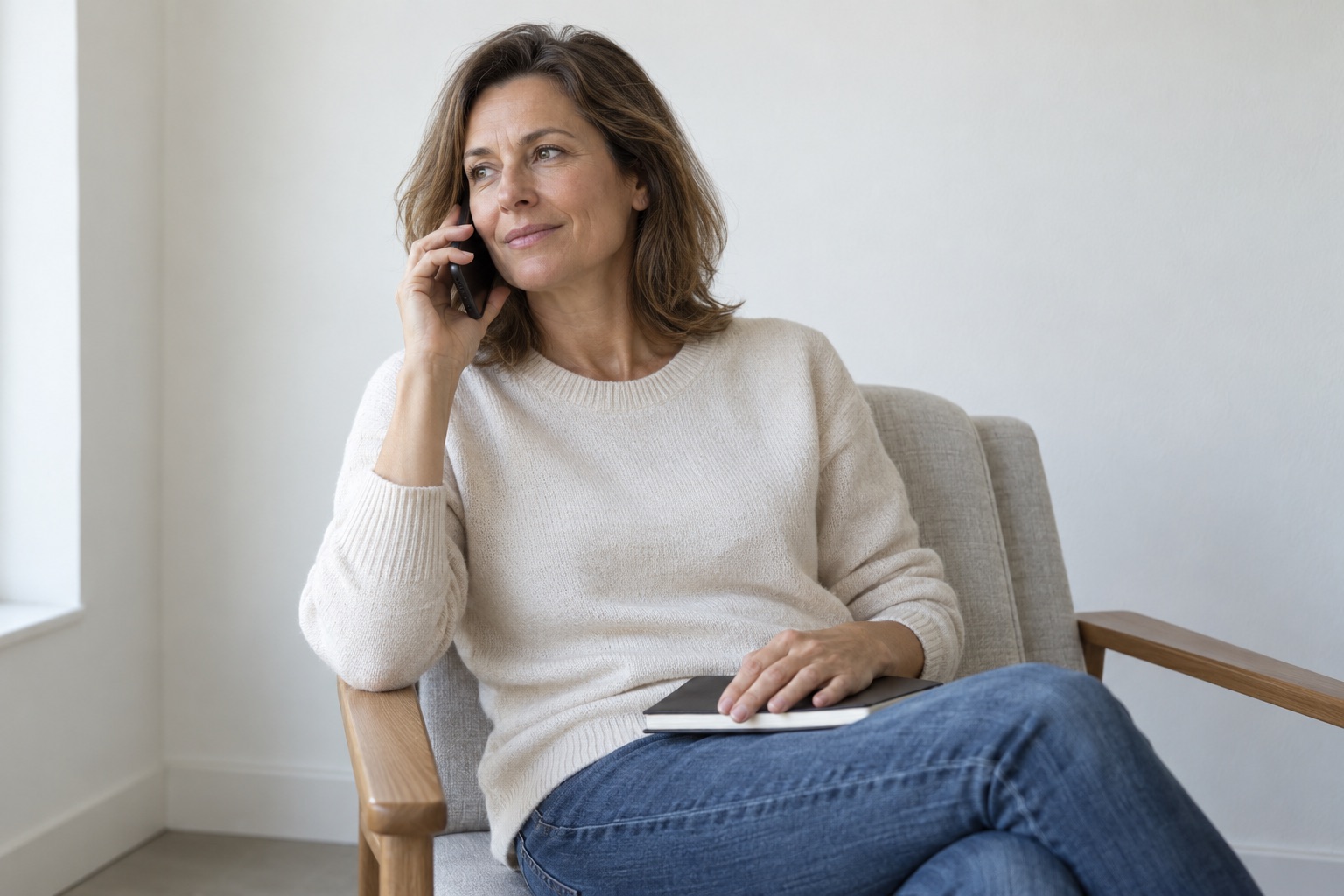 Woman speaking by telephone from a quiet room