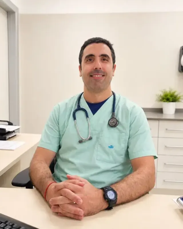 Dr Paolo, GP, at his desk