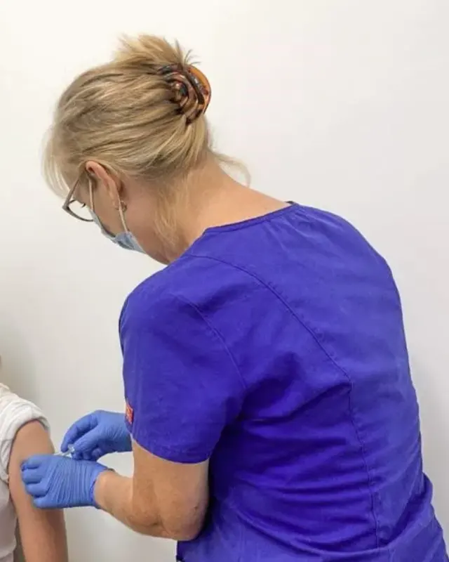 Nurse Susan giving a vaccination